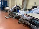 In 2020, patients on beds in the corridor of the emergency room of a hospital in the Montreal area. Shortages of medical staff are putting the system under huge pressure.