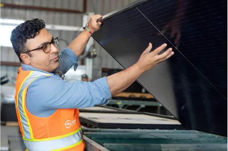 We Recycle Solar CEO Adam Saghei displays damaged solar panels for recycling at a factory in Yuma, Arizona.