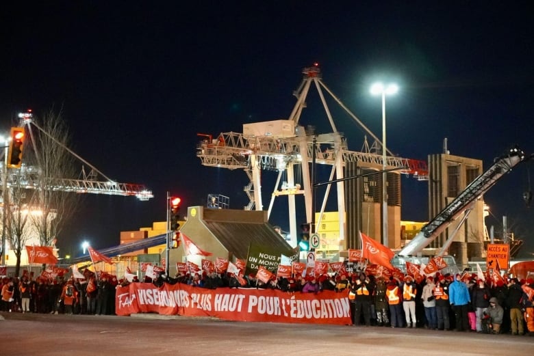 Teachers blockade port with banners and picket signs