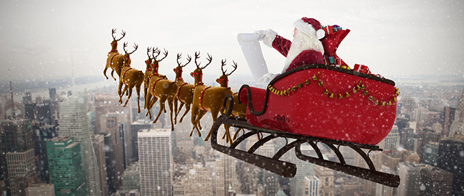 Picture of Santa's sleigh flying over the city
