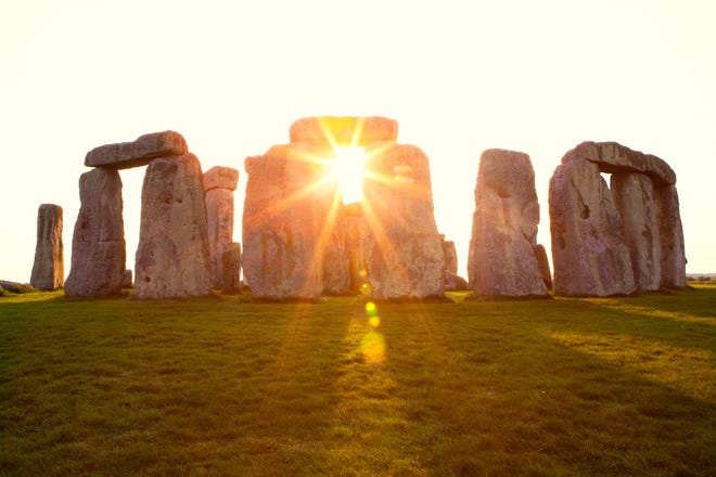 Ancient stones at the UNESCO World Heritage Site Stonehenge at sunset.