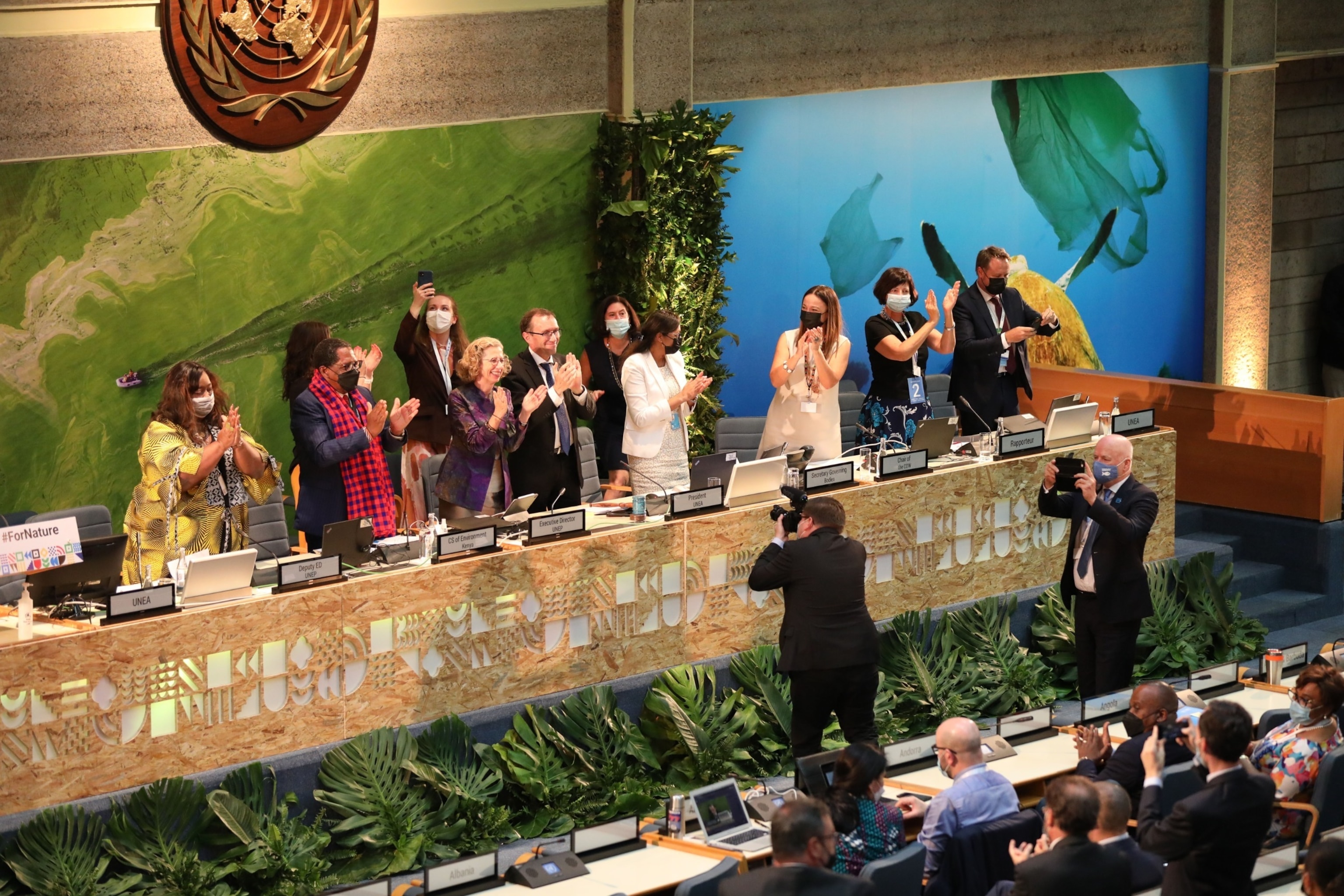 Photo: Delegates celebrate the adoption of a resolution to end plastic pollution during the closing session of the resumed fifth session of the United Nations Environment Assembly in Nairobi, Kenya, on March 2, 2022. 