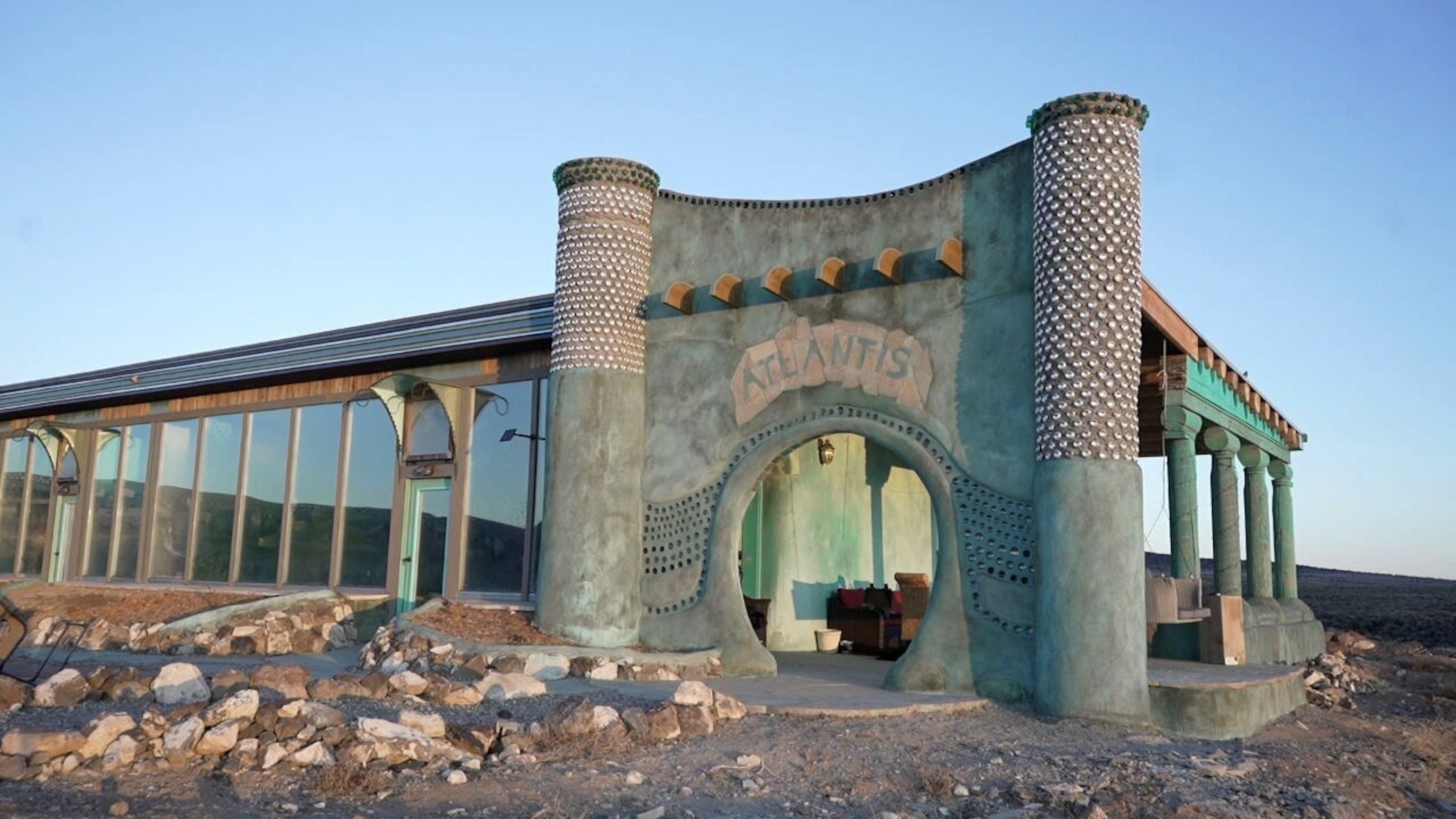 Photo: Outside Taos, New Mexico, a community of Earthships offers off-grid living, claiming it is the answer to building sustainable development.