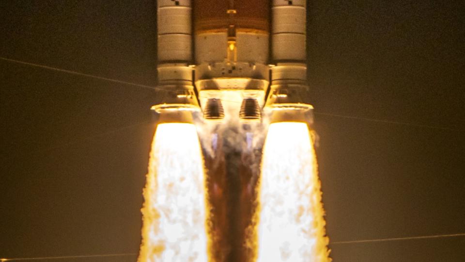 Two huge side boosters spouted yellow-orange flames, lifting the rocket's core stage while two main engines ignited