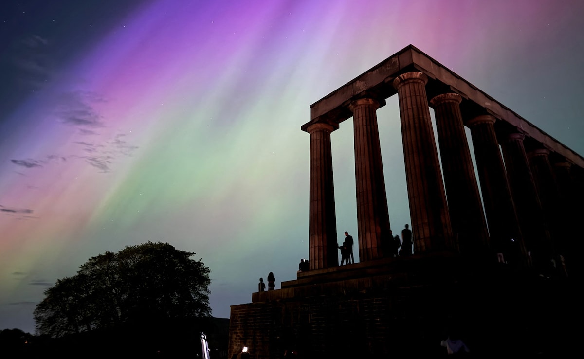 Northern Lights during a solar storm over the Scottish National Monument in Edinburgh