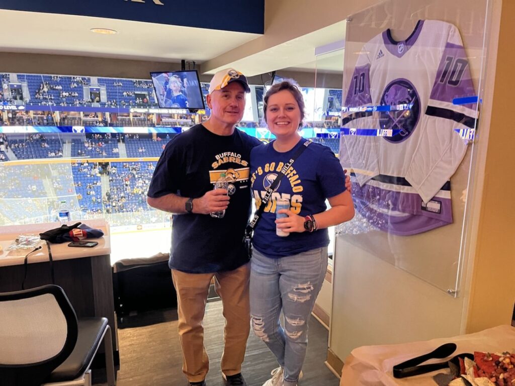 Father and daughter Gary and Emily Pacer have fun at a Buffalo Sabers game